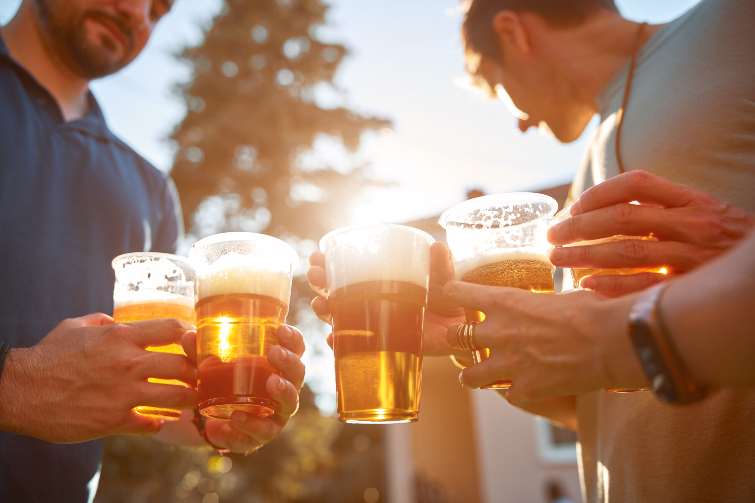 people drinking beer from beer keg truck