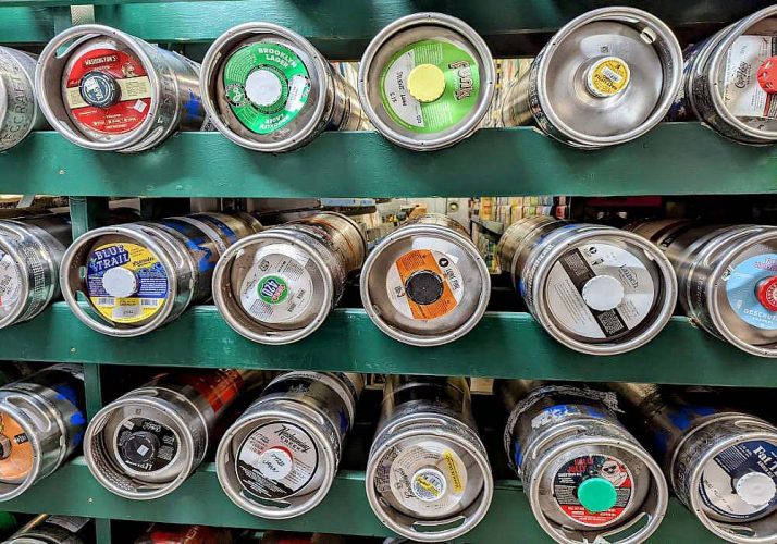 Best Place to Buy a Keg in Bucks County | Many cans of beer are lined up on a shelf.